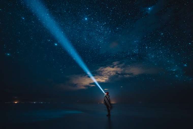 Ixchel under the night sky on the Salar de Uyuni, Bolivia, 2018 &mdash; from her travel archive.